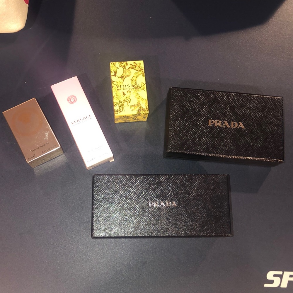 Prada and Versace boxes